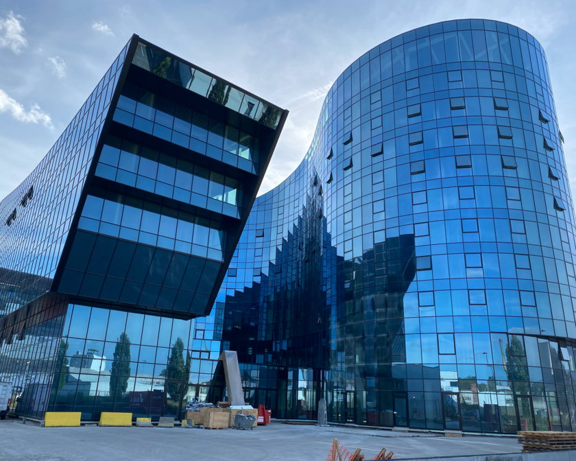 Blue shiny building with glass walls