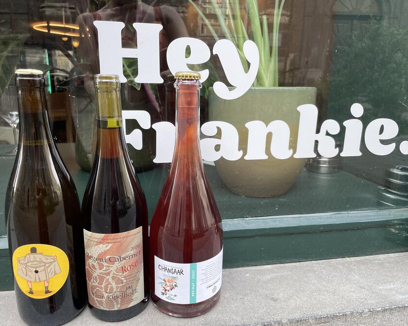Three bottles of wine on a windowsill