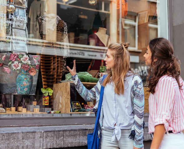 Two women walking around in the city