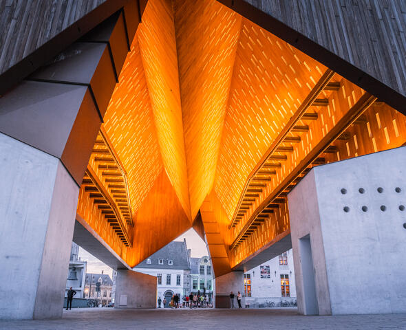 The city pavilion lights up from the inside thanks to lighting along the wooden interior finish