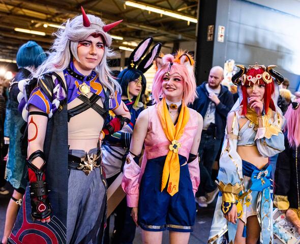 Three people dressed up at Facts