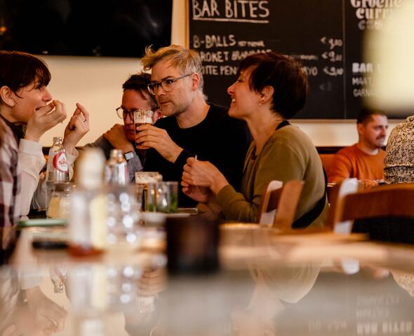 People enjoying a beer
