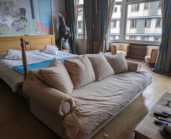 Bedroom with double bed and sofa