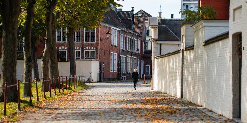 Woman walking in the Beguinage