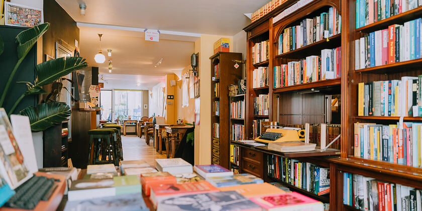 Bookshelves and table with books