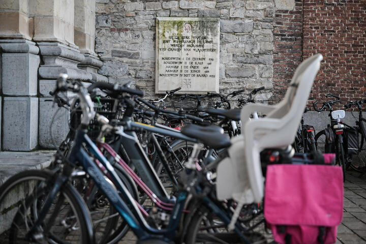 White memorial stone at St. Peter's Abbey with the names of the first counts of Flanders carved in it