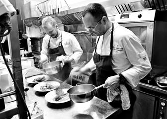 Chefs in action in the kitchen at Eetkaffee De Lieve