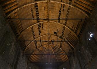 Inside of the chapel with a view of the roof trusses