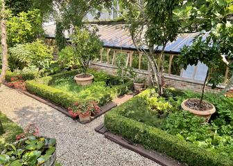 View of the kitchen garden and greenhouse
