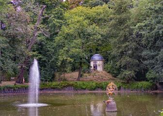 Pond with fountain in the green