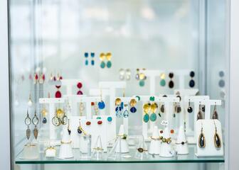 Jewellery with semi-precious stones in display case
