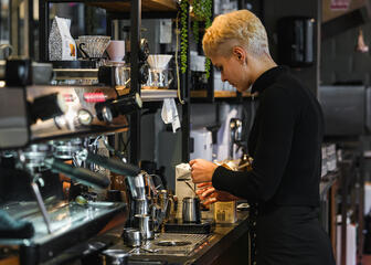 Person preparing coffee