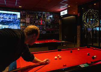 Person playing billiards 