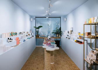 Light-blue interior of Clothilde with minimalistic counter and personal care products 