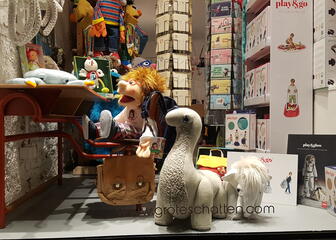 shop window with various stuffed animals and gadgets 