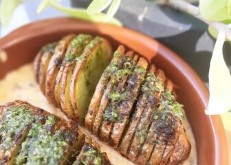2 Hasselback potatoes in a dish