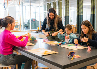 Tiany Kiriloff attends a workshop at the Museum of Industry with her three daughters