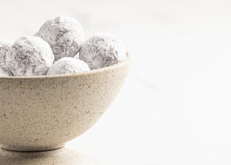 A bowl filled with champagne truffles