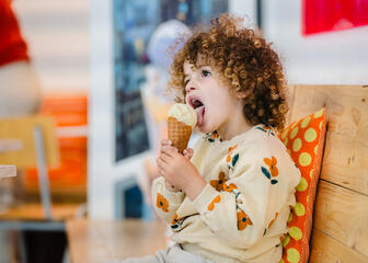 Child eats ice cream