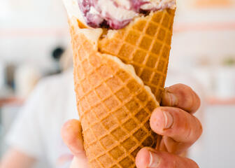 A scoop of ice cream on a cone
