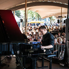 Piano player on the stage of the Jazz in the Park festival in Ghent. 