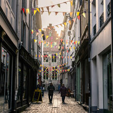 Colourful flags in a shopping street
