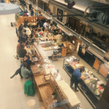 Top view of the busy open kitchen and the tables around it