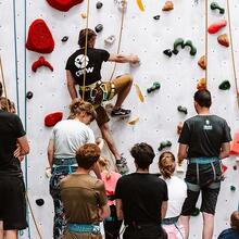 People watching an activity in climbing gym Bleau