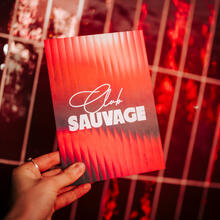 Red paper with Club Sauvage written on it